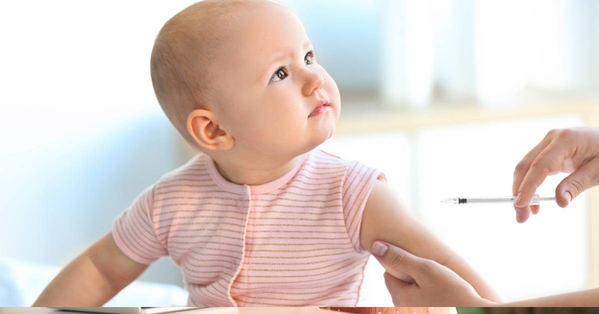 A loving parent holds their baby, symbolizing the protection offered by childhood vaccinations and a healthy future.